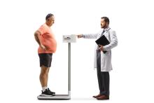 Doctor Measuring Weight